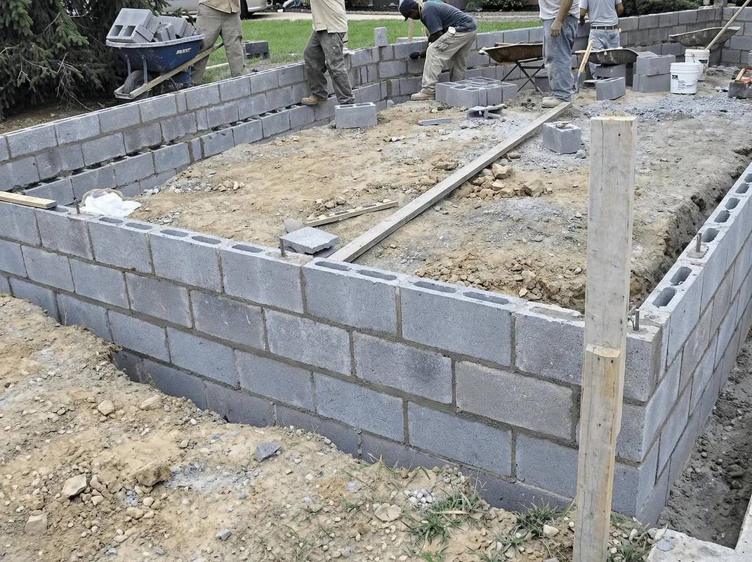Professionals building a foundation with blocks in Irvine, CA